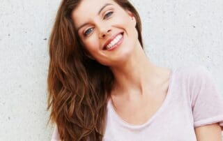 Satisfied patient posing with a smile at the clinic.