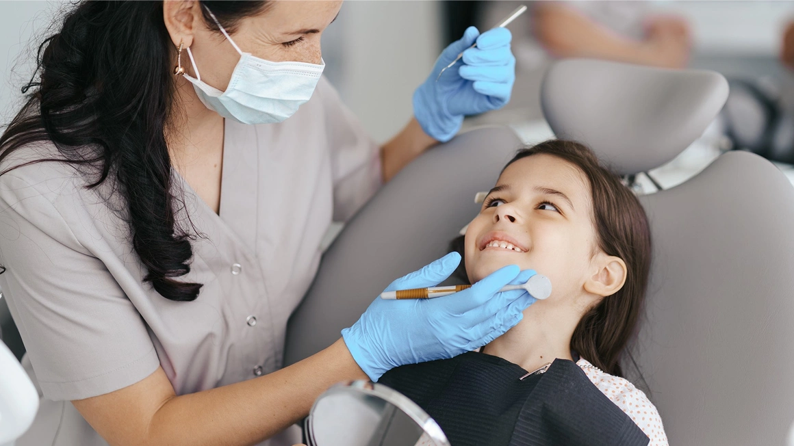 smiling child at dental clinic, North Bethesda, MD