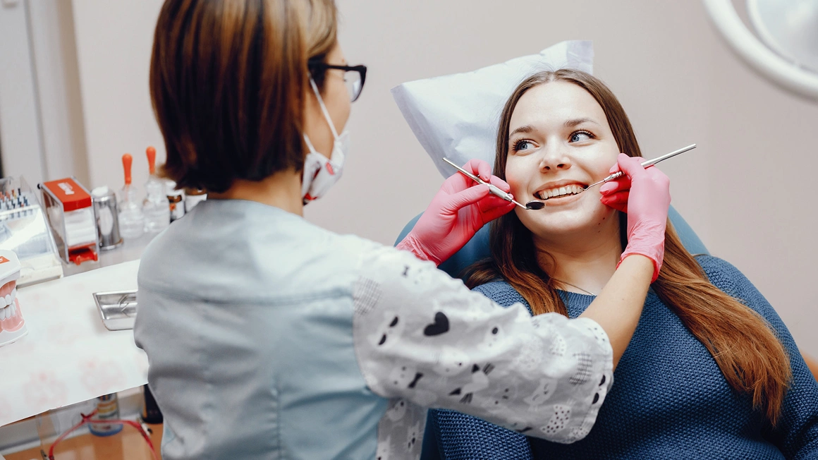 Adult patient receiving a professional dental cleaning from a general dentist